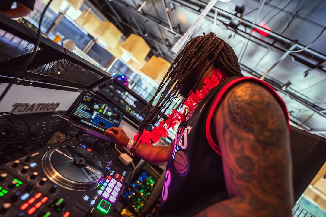 DJ performing at Hookava during a Crawl Reno event with colorful lighting