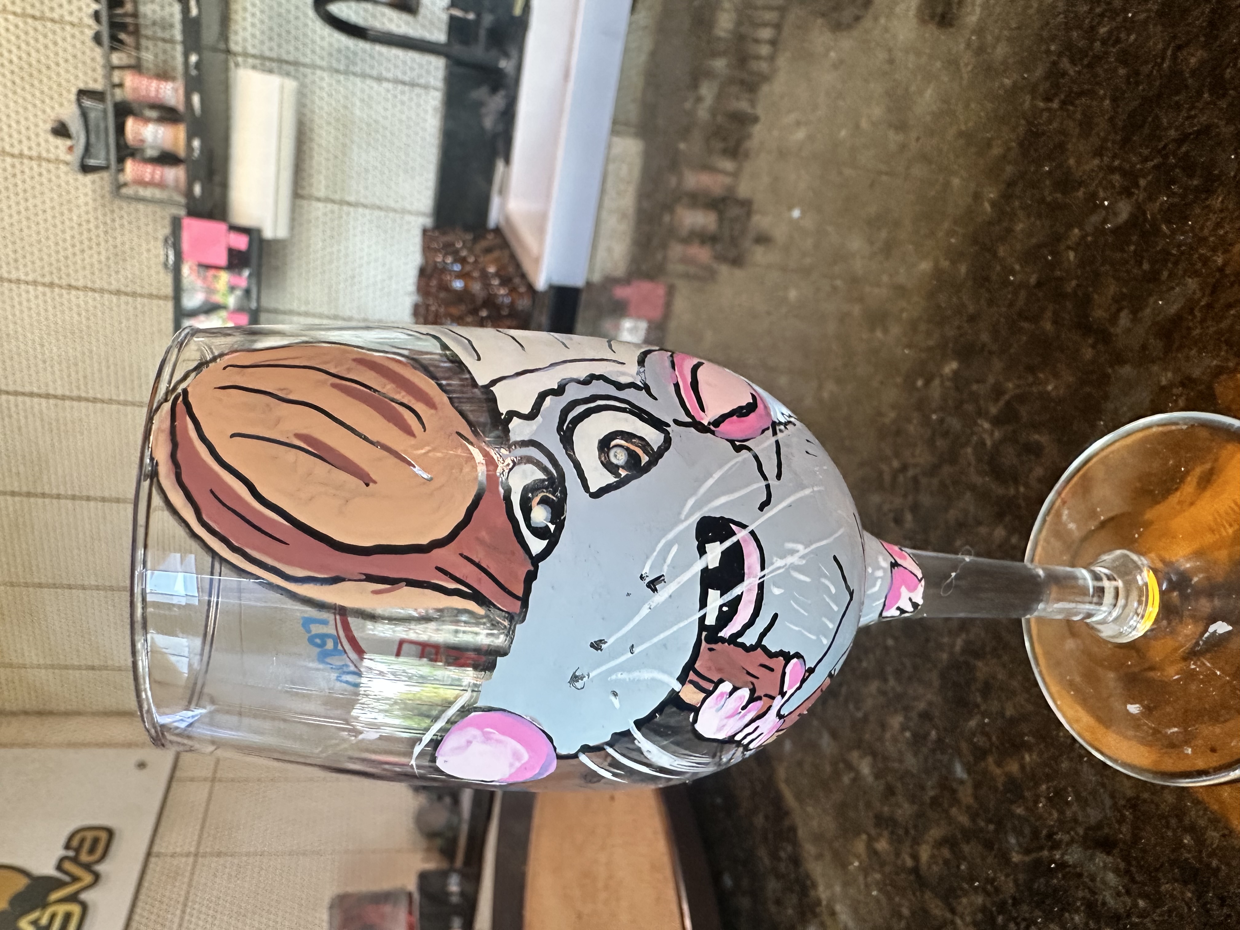 Hand-painted Remy from Ratatouille wine glass at Hookava bar